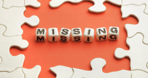 Image of puzzle put together with the center missing. The word missing is printed in the center. When the Numbers Are Half the Story