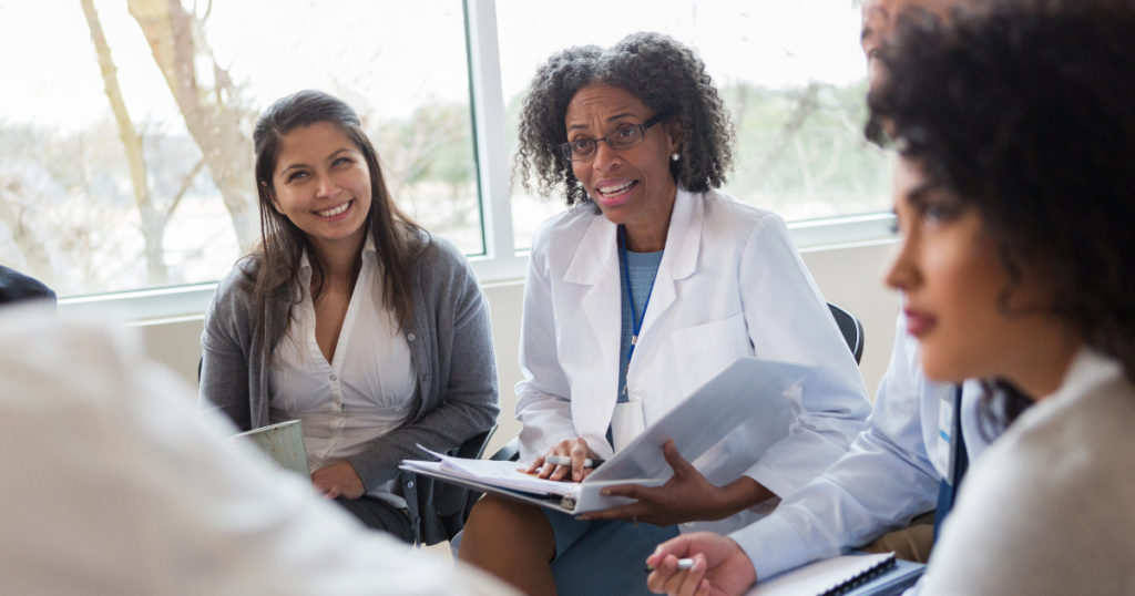 Why Leader Presence Matters in Infection Prevention Culture. Image of healthcare leader sitting among