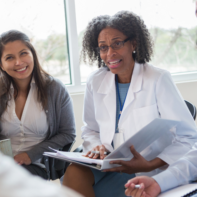 Why Leader Presence Matters in Infection Prevention Culture. Image of healthcare leader sitting among